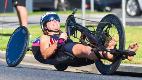 Mel Nicholls handcycling during a triathlon 