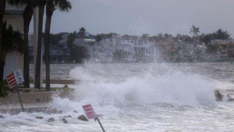 Waves from the Gulf of Mexico crash on shore