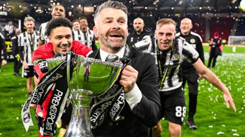 St Mirren Manager Stephen Robinson celebrates with the Premier Sports Cup Trophy at full time during a Premier Sports Cup Final match between St Mirren and Celtic at Barclays Hampden