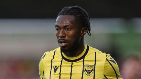 Kyle Edwards pictured concentrating hard while playing for Oxford United