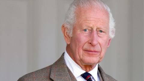 King Charles III wears a Royal Marines tie as he attends The Braemar Gathering 2024 at The Princess Royal and Duke of Fife Memorial Park on 7 September 2024 in Braemar, Scotland.