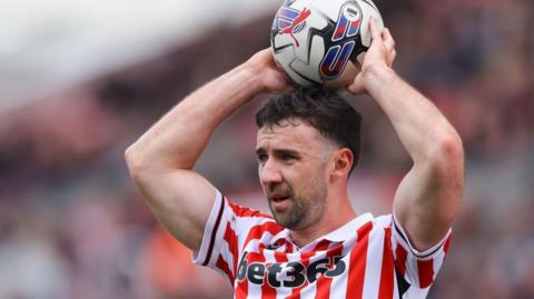 Enda Stevens prepares to take a throw-in for Stoke City