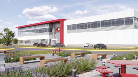 A computer-generated image of how the QTS data centre could look. Benches and picnic tables stand among shrubs in the foreground. In the background, a large, rectangular white and red building with a row of windows running along its second storey. Cars are parked outside.