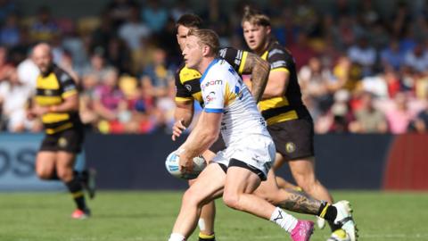 Lachie Miller looks for support to make a pass during the Super League match between York Knights and Leeds Rhinos