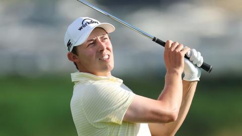Matt Fitzpatrick in his follow-through after playing an iron shot during the 2025 Open Championship
