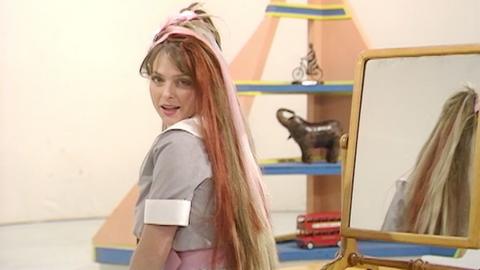 Blue Peter presenter Janet Ellis showing off her multi-coloured synthetic hair extensions