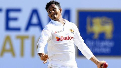 Praveen Jayawickrama prepares to bowl the ball