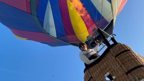 Max in a multi-coloured hot air balloon