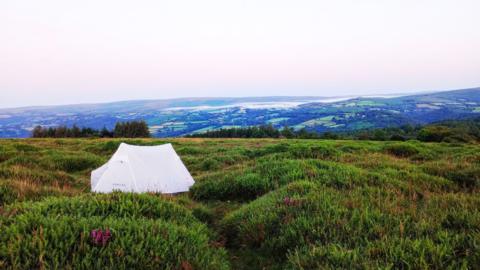 A white tent in a field