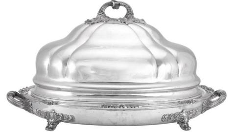 An Indian Silver Venison-Dish and Cover by Hamilton & Co. of Calcutta. The dish is large with ornamental flourishes at its base and sides.