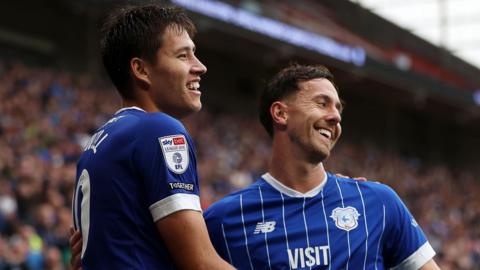 Rubin Colwill (left) celebrates scoring for Cardiff with Ryan Wintle