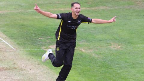 Zaman Akhter of Gloucestershire celebrates after claiming a wicket