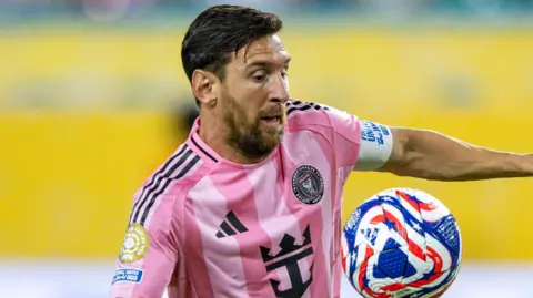 Lionel Messi controls the ball