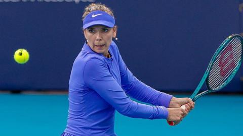 Katie Boulter takes a shot