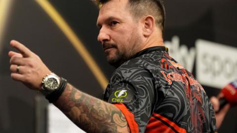 Jonny Clayton celebrates in the Premier League