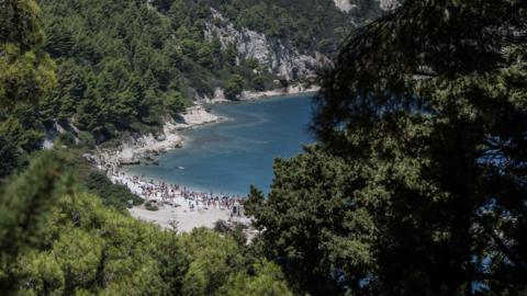 Visitors at the beach on Sazan island, Albania