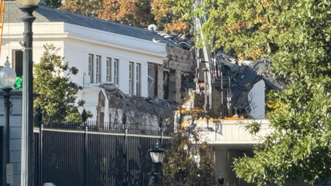 Photo shows construction to the East Wing of the White House, with cranes hovering as large chunks of the edifice are missing