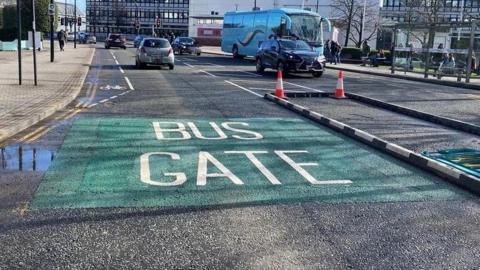 The words bus gate painted in white on Arundel Gate in Sheffield