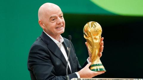 Infantino lifts the world cup trophy