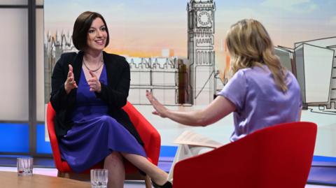 Bridget Phillipson and Laura Kuenssberg sat on red chairs facing each other - both speaking with hands raised.