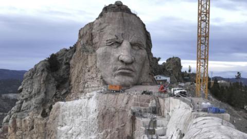 Image of Crazy Horse's face carved into a cliffside
