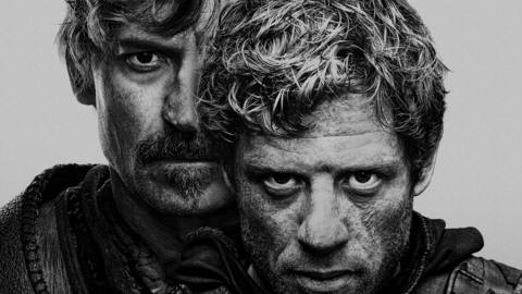 James Norton and Nikolaj Coster-Waldau in black and white photo. 

