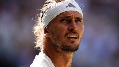 Alexander Zverev looks on