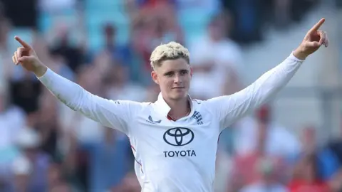 England's Jacob Bethell celebrates taking a wicket