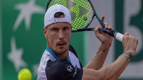 Marton Fucsovics hits shot