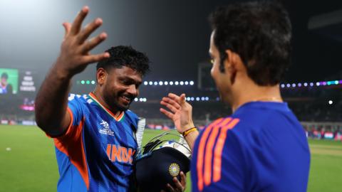 Sanju Samson of India celebrates victory alongside Gautum Gambhir, Head Coach of India following the ICC Men's T20 World Cup India & Sri Lanka 2026 Super 8 match between India and West Indies at Eden Gardens
