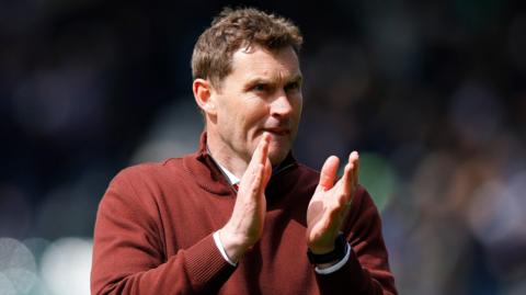 Exeter City interim boss Matt Taylor applauds