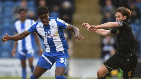 Colchester's Micah Mbick playing against Gillingham