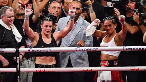 Katie Taylor and Amanda Serrano in the ring after their fight