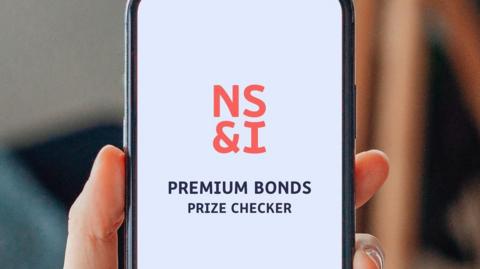 NS&I of Premium Bonds Prize Checker displayed on a phone.