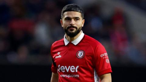 Sam Morsy standing on the pitch during a match for Bristol City