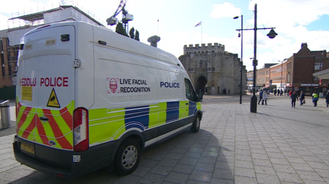 Police van with 'Live Facial Recognition' written on the side, with Southampton's Bargate in the background