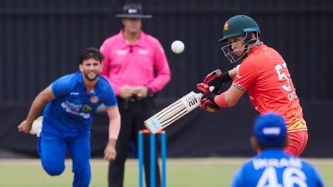 Zimbabwe's Ben Curran plays a shot off the bowling of Afghanistan's Azmatullah Omarzai