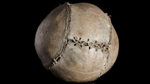 An almost 500-year-old football with thick stitching