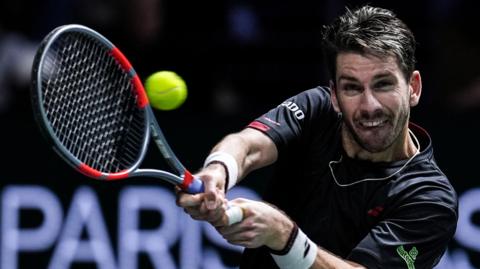 Cameron Norrie hits a backhand