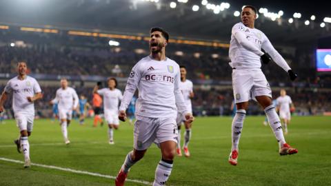 Marco Asensio celebrates his late penalty against Club Brugge. 