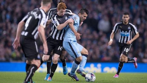 Jack Colback and Sergio Aguero battle for the ball.