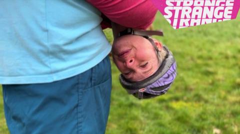 Someone hanging upside down