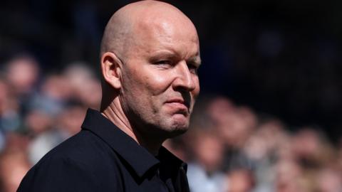 Henrik Pederson looks to his left with a straight face