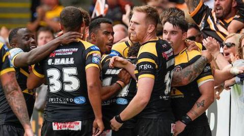 Rugby League - Betfred Super League Round 18 - Castleford Tigers v Catalans Dragons - the Mend A Hose Jungle, Castleford, England - Castleford Tigers players and fans celebrate Tex Hoy’s match winning try