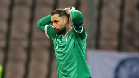 Gianluigi Donnarumma reacts with disappointment after Italy fail to make the 2026 World Cup 