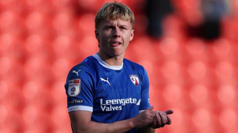 James Berry claps the fans after a match during his time playing for Chesterfield