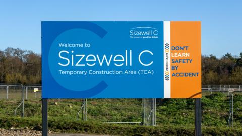 Large blue and orange sign saying 'Sizewell C temporary construction area'