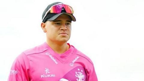 Close up head shot of Somerset batter Will Smeed in his pink T20 Blast shirt