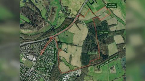 A birds-eye-view map showing the developer's proposal to build a major housing estate on a farmland in Guildford.