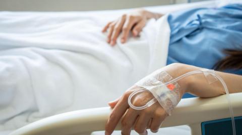 Patient in hospital bed